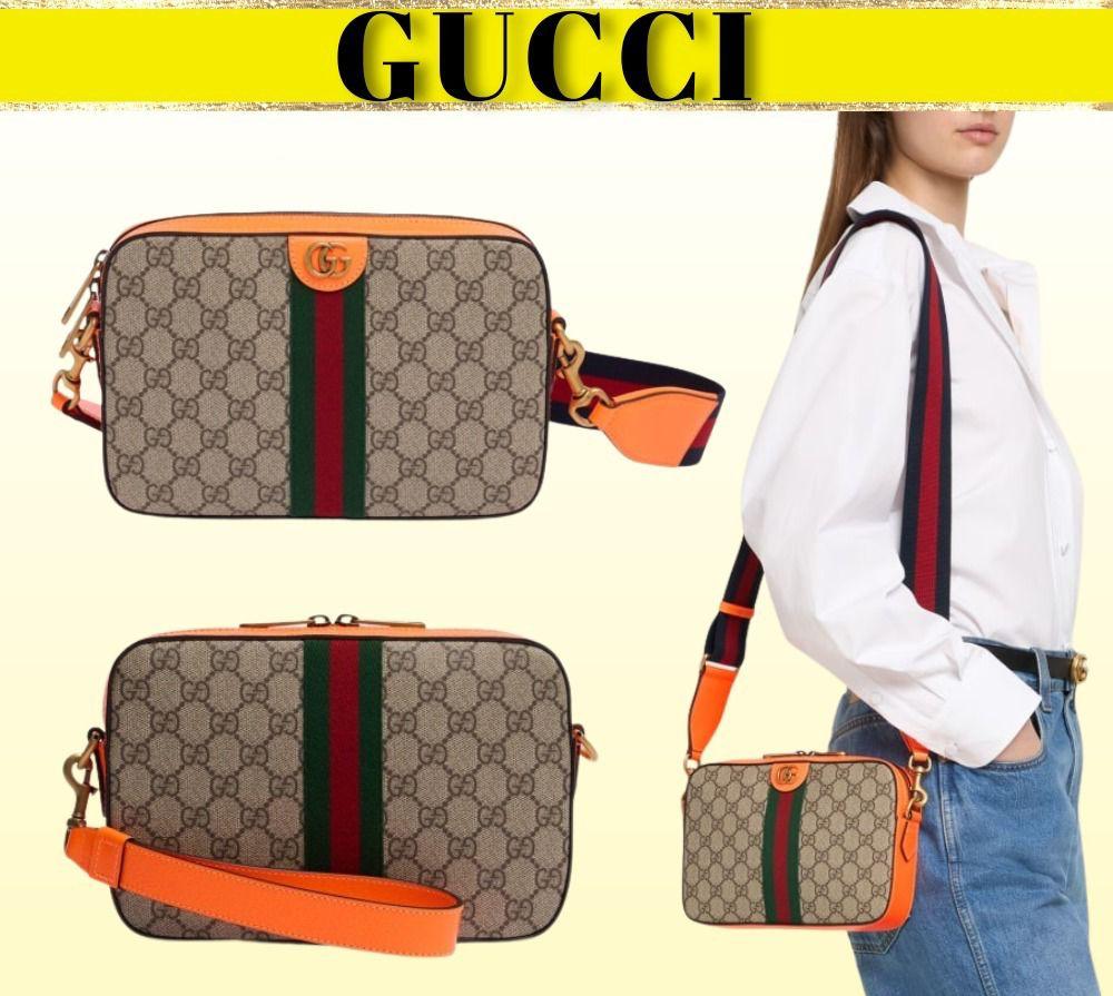 Gucci piel cafe con naranja