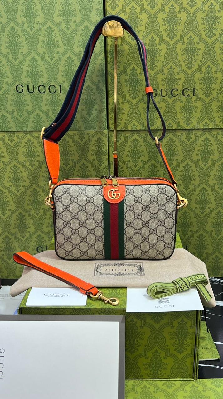 Gucci piel cafe con naranja