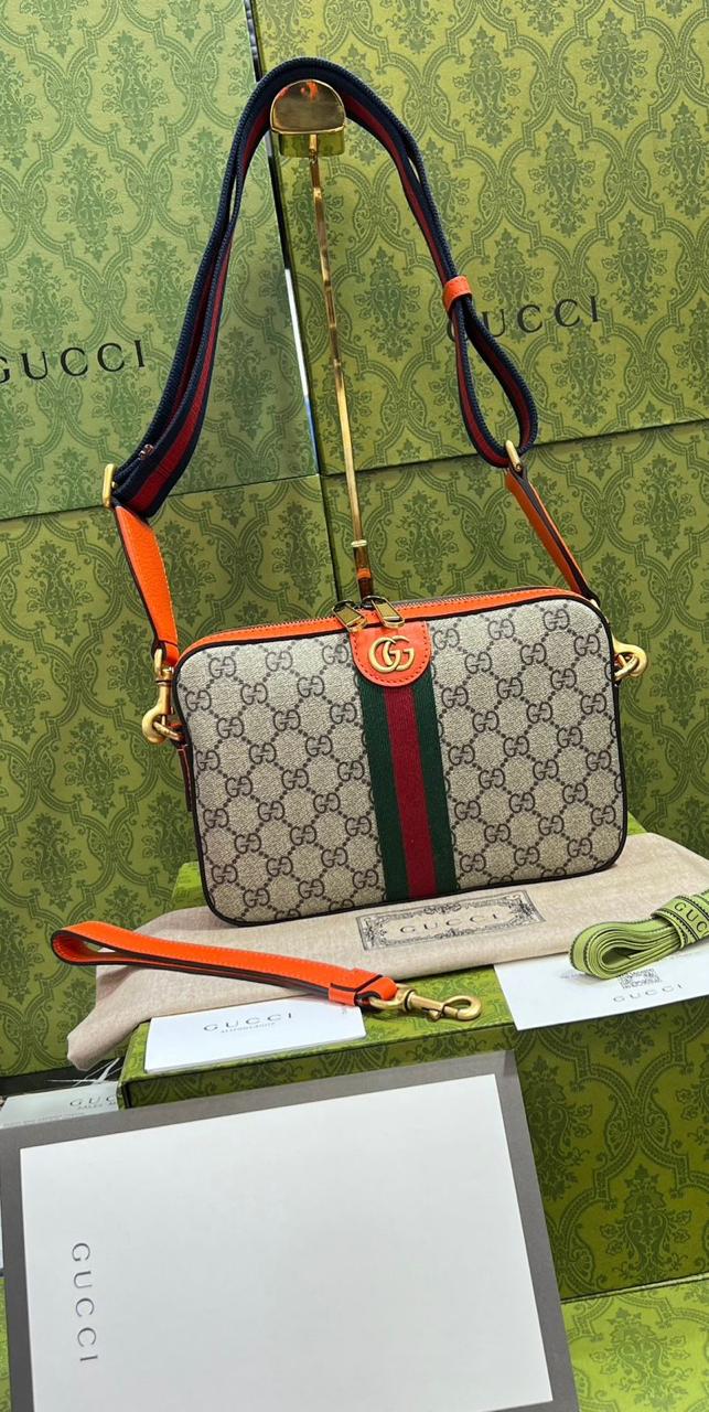 Gucci piel cafe con naranja