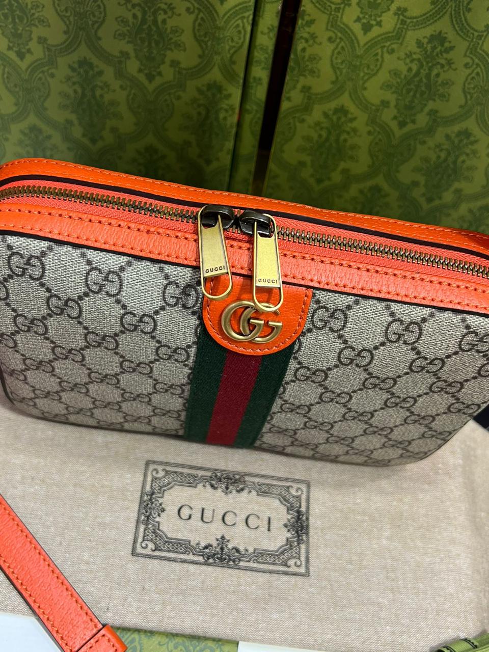 Gucci piel cafe con naranja