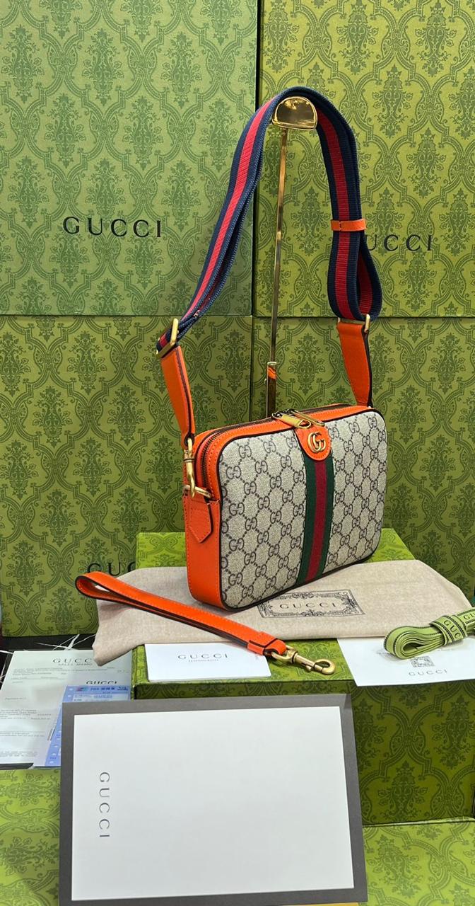 Gucci piel cafe con naranja