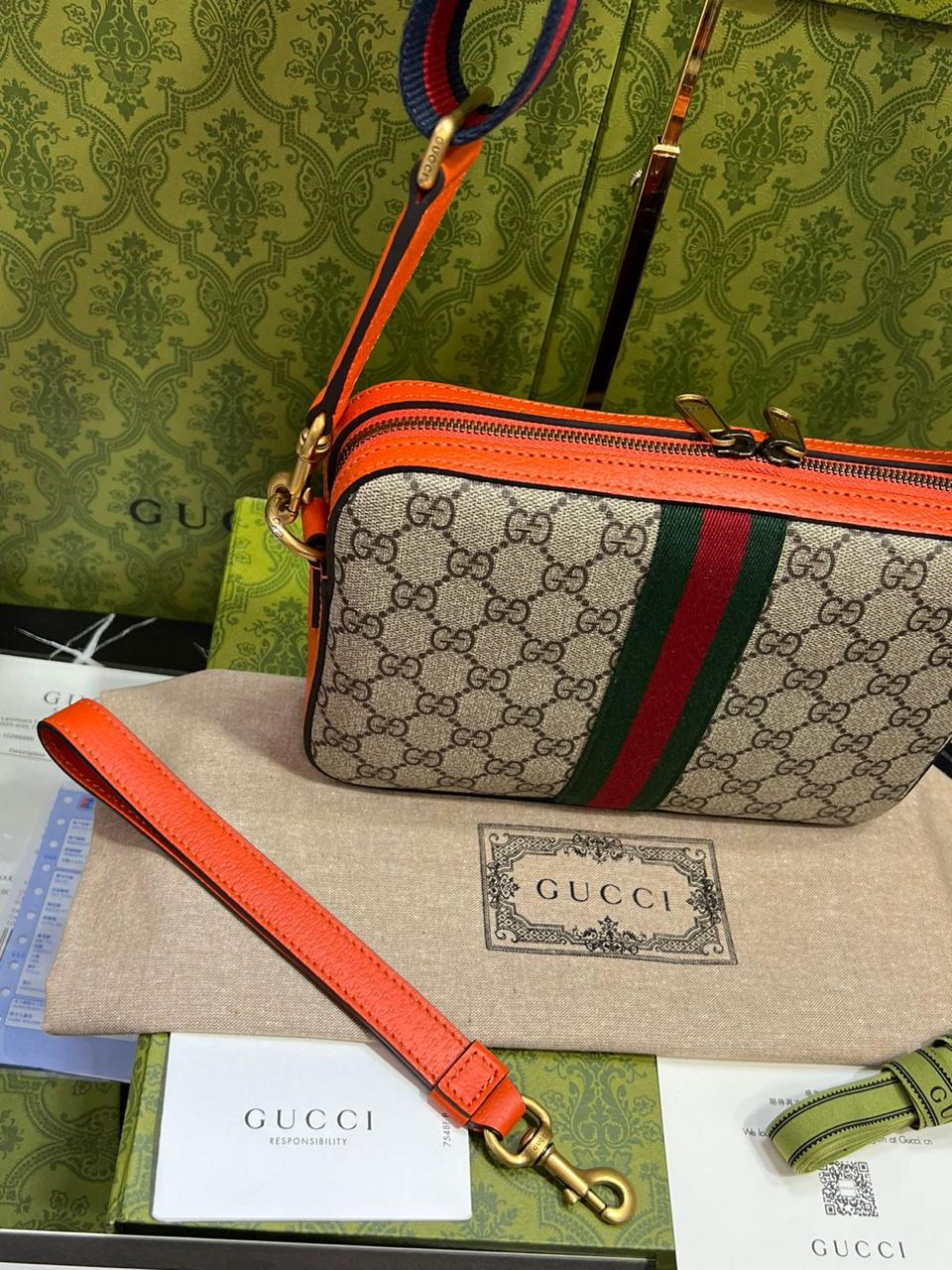 Gucci piel cafe con naranja