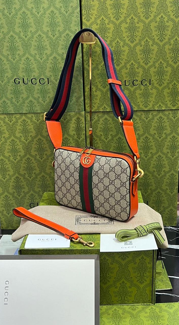 Gucci piel cafe con naranja