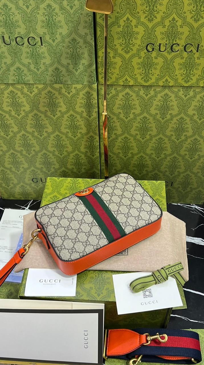 Gucci piel cafe con naranja