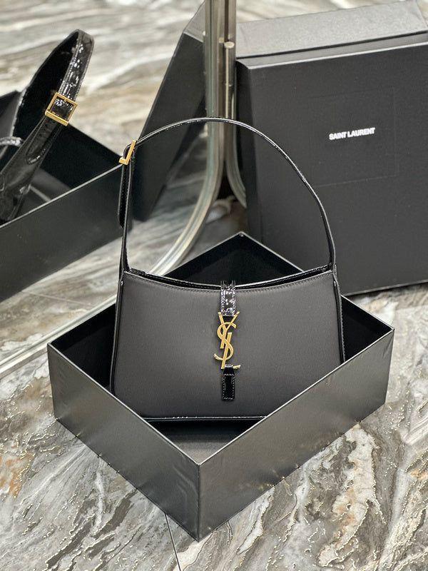 Saint Laurent YSL piel con acabados en tela y charol